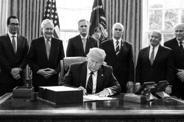 President Trump signs the H.R. 748, Coronavirus Aid, Relief, and Economic Security (CARES) Act (Erin Schaff/Bloomberg)