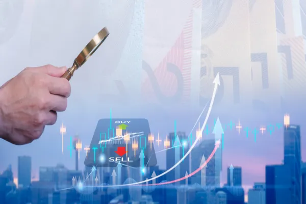 man use magnifying glass searching for best option to investment in stock market property or mutual funds Data Search information stock market trading graph