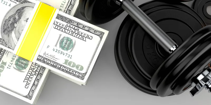 Dollar currency with dumbbell