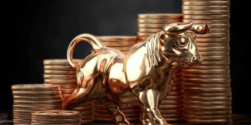 Golden bull and coins . Financial investment in bull market and growth of stock market concept.