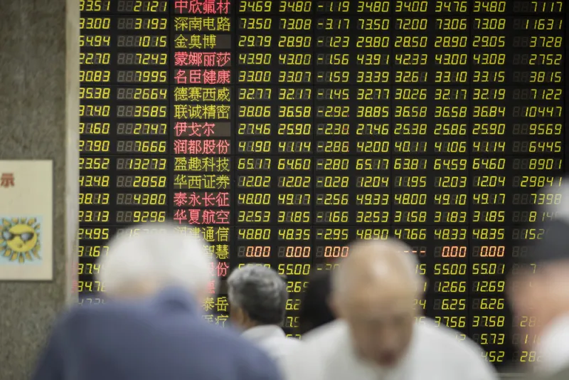 A securities brokerage in Shanghai, China. (Qilai Shen/Bloomberg)